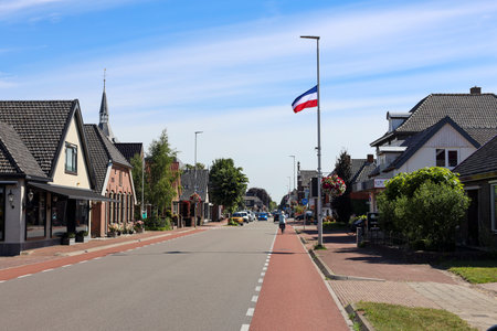 flags upside down in Wezep and Oldebroek with protest farmers signs in the Netherlandsのeditorial素材