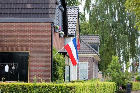 flags upside down in Wezep and Oldebroek with protest farmers signs in the Netherlandsのeditorial素材