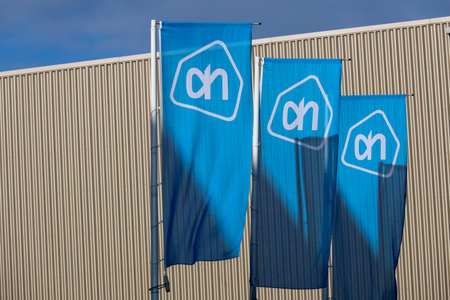 Logo of albert heijn on flags at delivery warehouse in Bleiswijk in the netherlandsのeditorial素材
