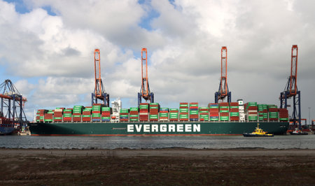 Container ship Ever Govern of Evergreen is unloaded and loaded with containers on the Maasvlakte in...