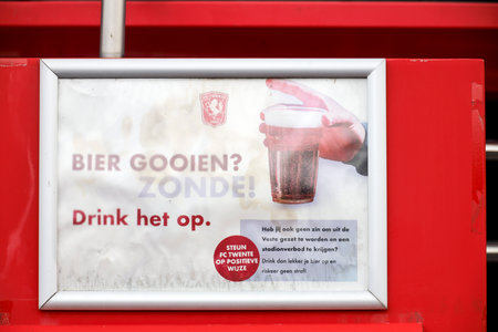 Grolsch Veste stadium of FC Twente in Enschede with warning not to throw beer but drink itのeditorial素材