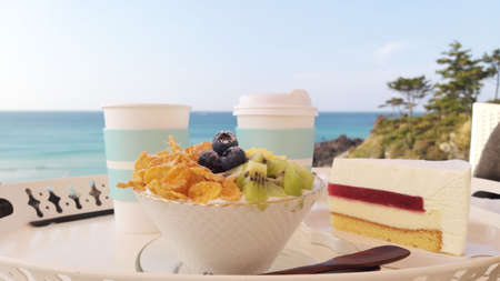 a dessert at a cafe with a view of the sea
