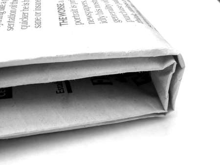 Folded newspaper isolated on white.の写真素材
