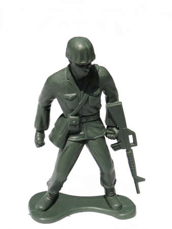 Close-up action toy soldier, isolated on white.