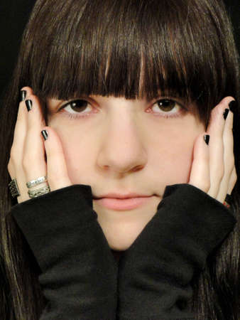 Close-up face portrait with hands.の写真素材