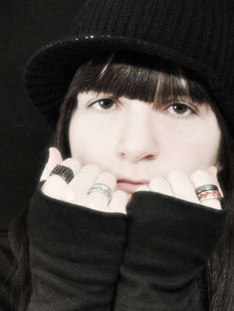 Portrait of a punk young girl leaning on her fists.の写真素材