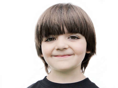 Adorable smiling little boy isolated on white background.の写真素材
