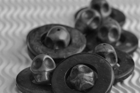 many skulls on a circular disk looking in different directions