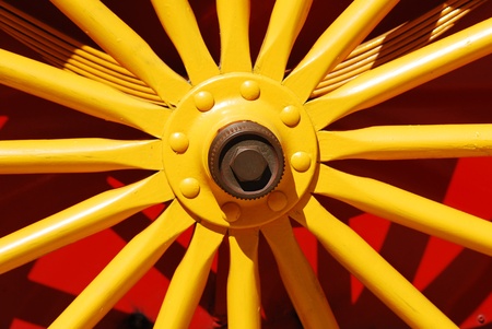 red and yellow wagon wheel at a circusの写真素材