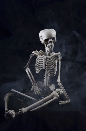 this skeleton has had to much to smokeの写真素材