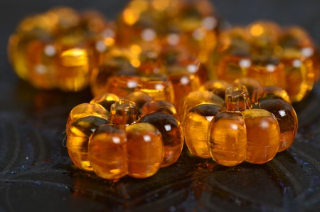 A shiny close up of crystal pumpkins on a spider web background