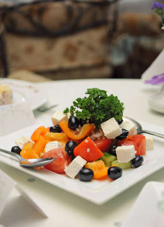 Greek salad in plate on a tableの写真素材