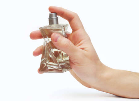 Man's hand with bottle of perfume isolated on white backgroundの写真素材