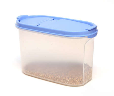 Transparent plastic food container with grain isolated on white background