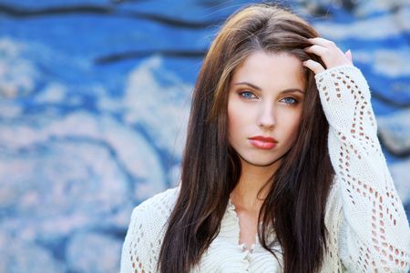 Beautiful  woman standing outdoor modern backgroundの写真素材