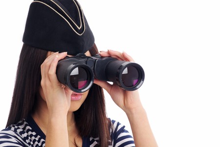Woman looking through binoculars isolated on whiteの写真素材