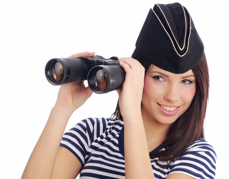 Woman looking through binoculars isolated on whiteの写真素材