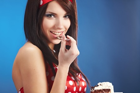 Beauty pin-up female with the cakeの写真素材