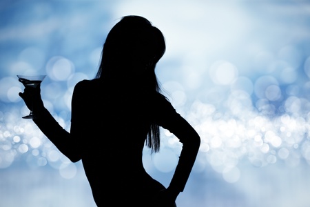 dancing silhouettes of women with champagne  in a nightclub  の写真素材