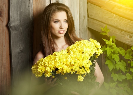 Woman holding yellow flowers . otdoor shootの写真素材