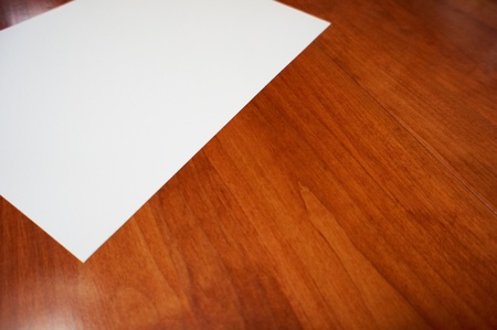 blank white paper on rubber wood background の写真素材