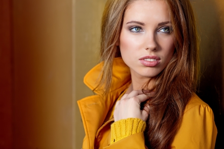 young brunette woman portrait in autumn color の写真素材