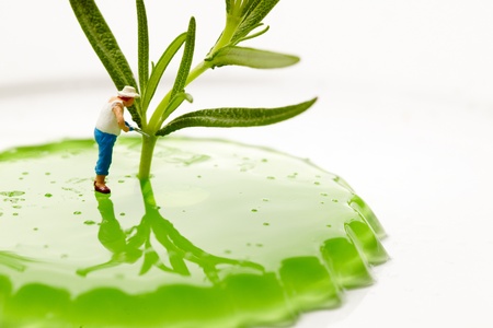 Miniature World. Gardener working on macro landの写真素材