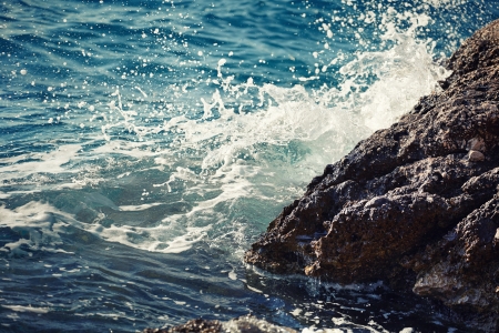 Stone breakwater with breaking waves. Adriatic Sea.の写真素材