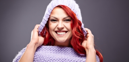 portrait of beautiful woman redhair on greyの写真素材