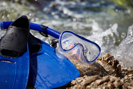 Mask and flippers on the beachの写真素材