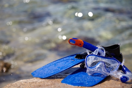 Mask and flippers on the beachの写真素材