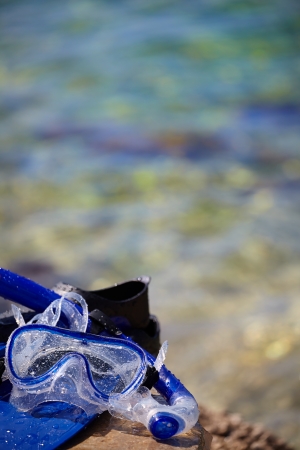 Mask and flippers on the beachの写真素材