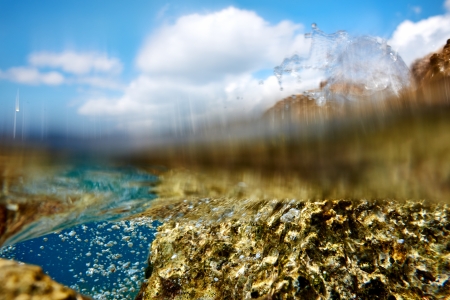Split view with rocky coast and underwate の写真素材
