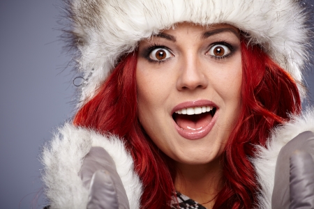 beautiful red hair woman in warm clothing の写真素材