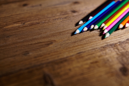 Set of color pencils on old woodenの写真素材