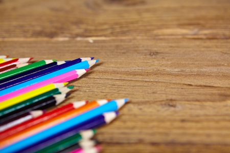 Set of color pencils on old woodenの写真素材