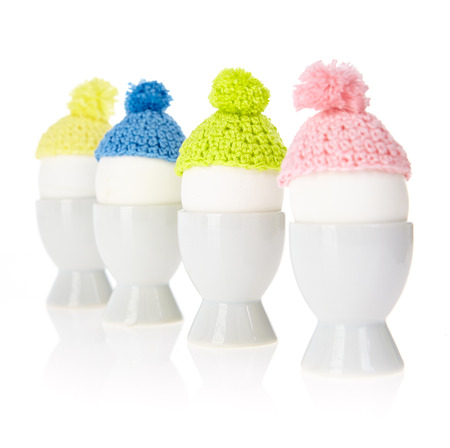 Easter egg with mutch in cups isolated over white の写真素材