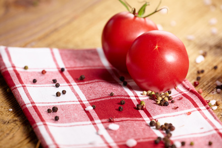 Tomatoes lying on old table. Diet foodの写真素材