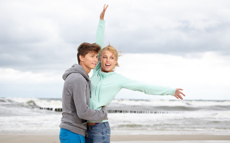 Couple Enjoying Romantic autumn beach の写真素材