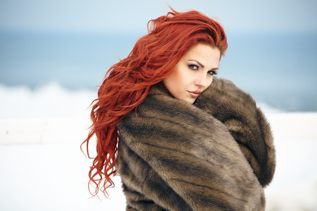 Young woman winter portrait. Shallow dof.の写真素材