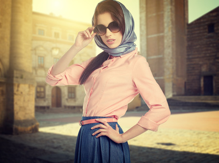 Fashionable woman on the streets of a small Italian townの写真素材