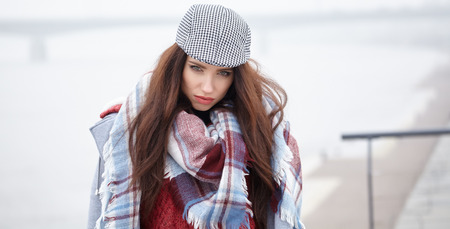 fashion woman walking outdoor against an city river landscapeの写真素材