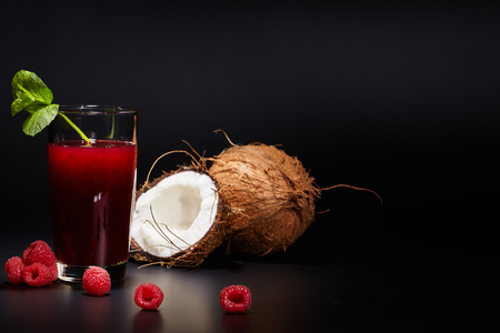 Glasses with fresh organic vegetable and fruit juices isolated on black. Detox diet.の写真素材