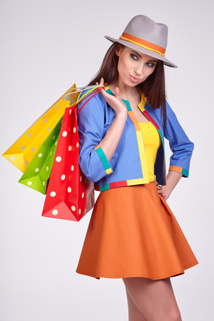 Smiling spring woman with shopping bagsの写真素材
