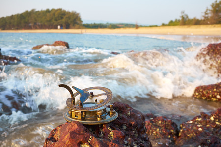 Vintage Sundial on a tropical beachの写真素材