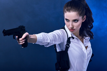 special tactics woman holding up her weaponの写真素材