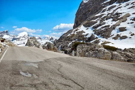 A road in a high mountain pass in the Dolomitesの写真素材