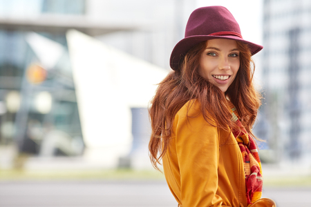 Woman in autumn cityの写真素材