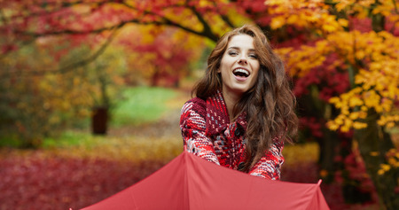 Amazing woman in autumn parkの写真素材