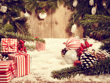 Christmas decorations on a rustic wood background, vintage retro styleの写真素材